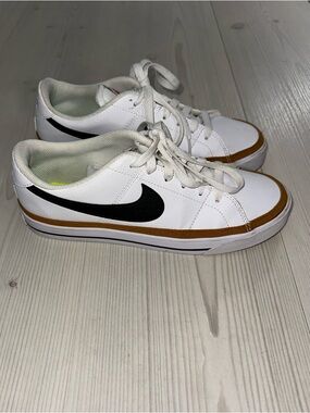 Nike White Low-Top Sneakers with Black Swoosh and Tan Trim